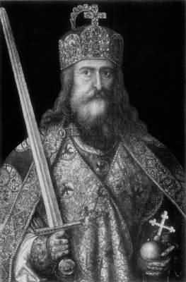 A portrait of Charlemagne. He has long hair and a beard, and wears richly embroidered clothes and a jewelled and decorated crown. He holds an orb with a cross in his left hand, and a raised sword in his right.